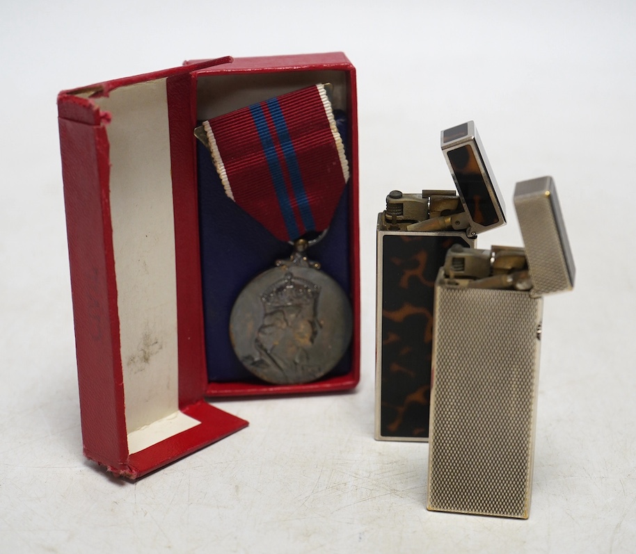 Two Dunhill lighters and a Coronation medal. Condition - some scratches